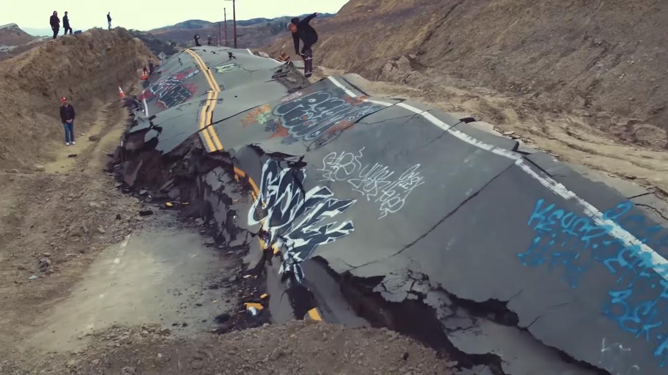 They Ride a Destroyed Road with Their Skateboards