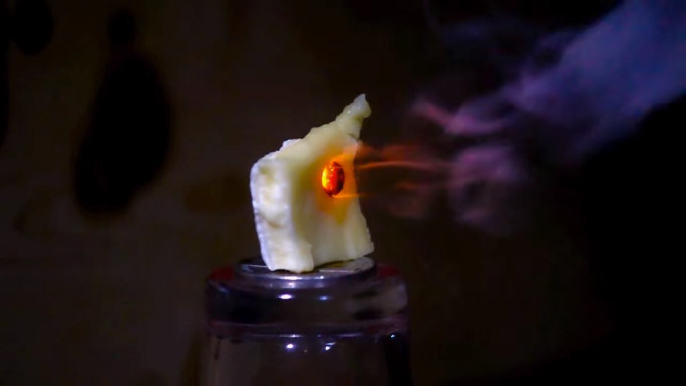 Just an Invisible Laser Cutting Through Cheese