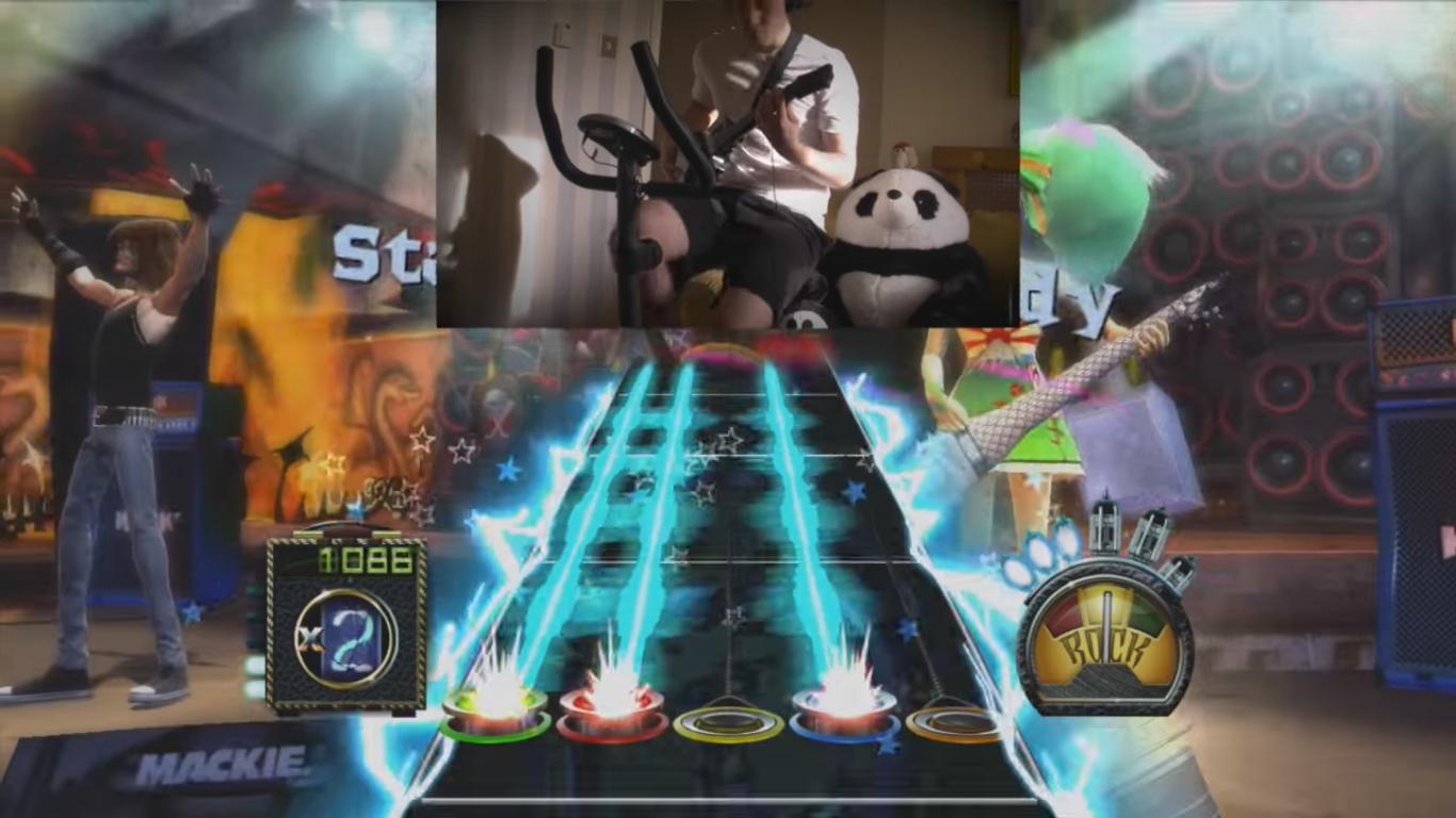 This Guy Exercises on His Stationary Bike While Playing Guitar Hero