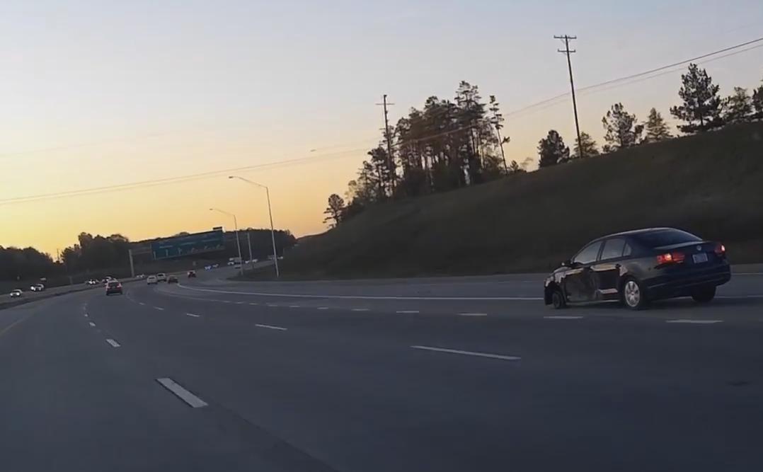 Car Driving With Only Three Wheels on the Highway